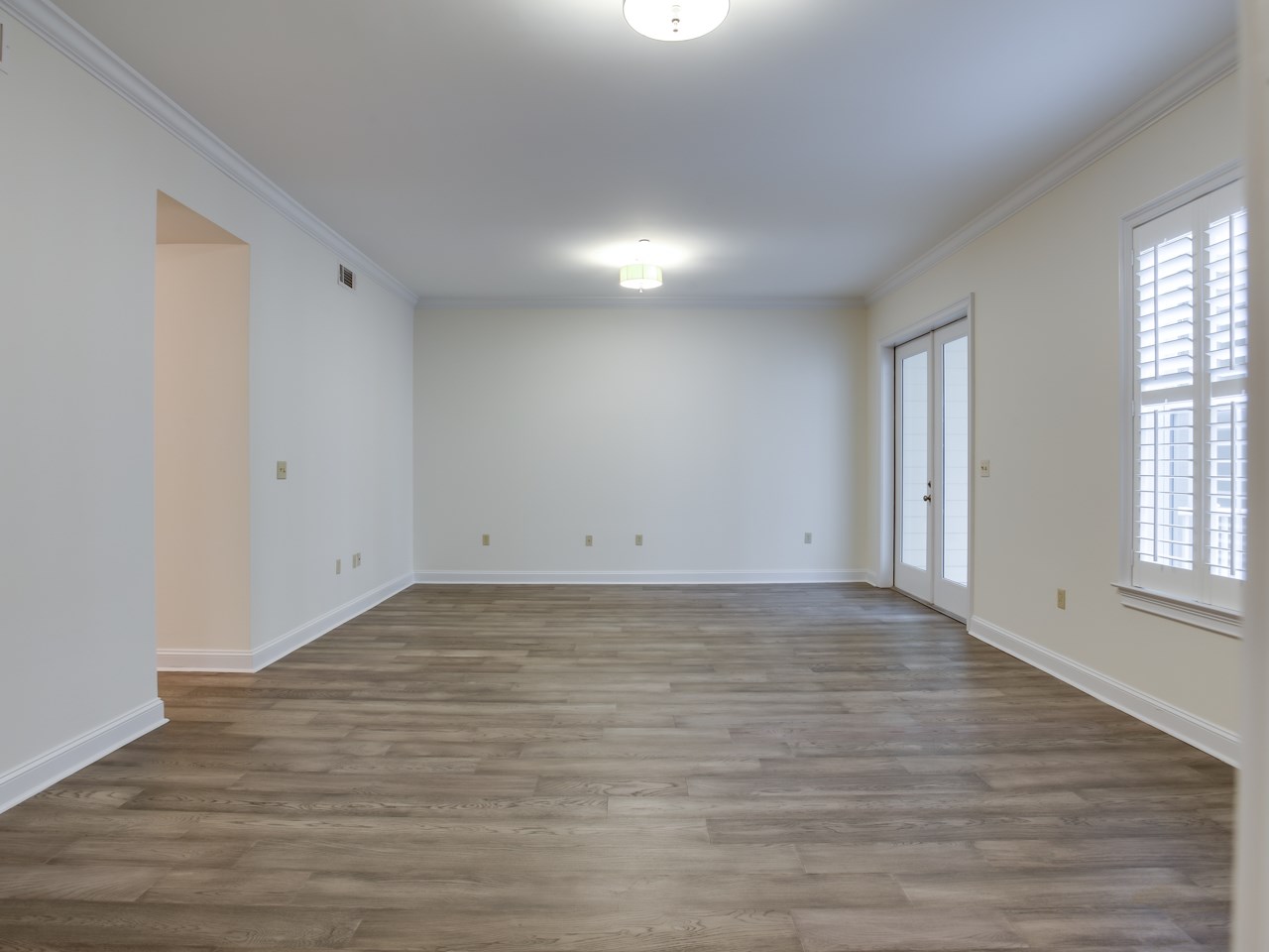 597 Lexington Road, Unit 302 Memphis, TN 38157 - Photo 5 of 18 Stylish new hardwood floors; doors to screened porch.