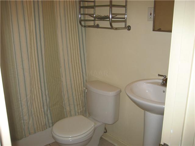 4833 Dee Road Memphis, TN 38117 - Photo 6 of 25 Tiled floor, pedestal sink and linen closet.