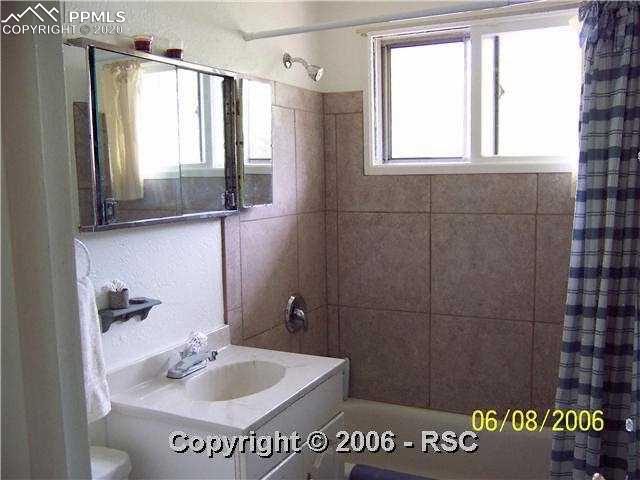 2520 Alexander Road Colorado Springs, CO 80909 - Photo 8 of 12 Full bath on main level
