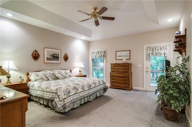Master bedroom, trey ceiling, adjoining bath & deck.