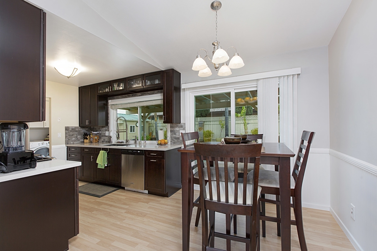 13426 Racquet Court Poway, CA 92064 - Photo 6 of 24 Wainscoting wraps the dining room.