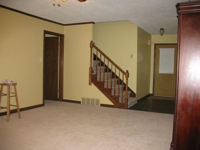 6853 Rockingham Road Memphis, TN 38141 - Photo 6 of 10 Looking at the front door the stairs, and the hall to the downstairs bedrooms.