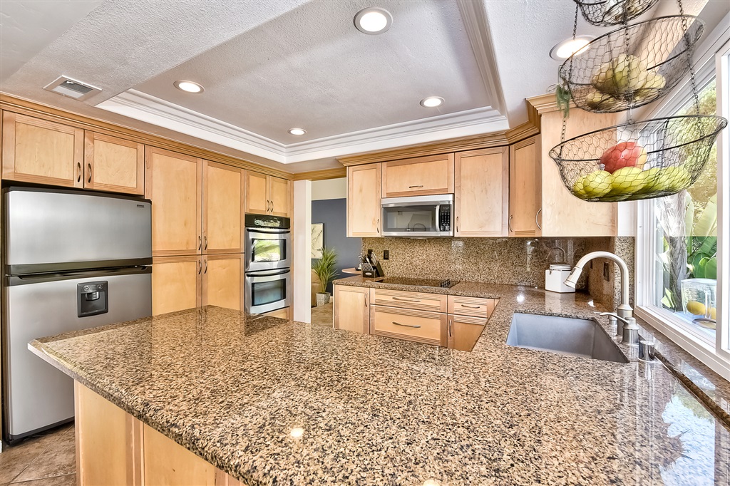 441 Raphael Court Encinitas, CA 92024 - Photo 11 of 25 Enjoy the recently upgraded kitchen with ample dining spaces on both sides of the kitchen