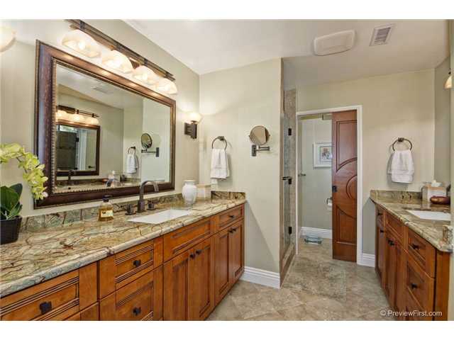 10934 Rim Road Escondido, CA 92026 - Photo 22 of 25 Master bath has two vanities, extra large shower and private WC. A large walk in closet adjoins this bathroom.