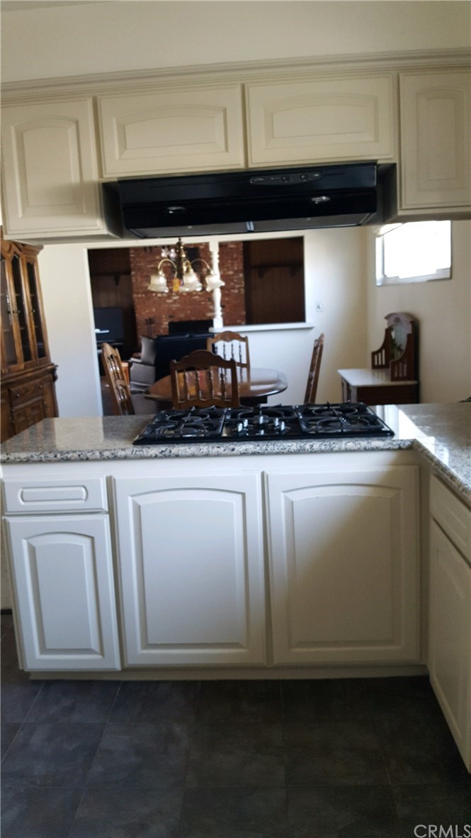 15744 Marlinton Drive Whittier, CA 90604 - Photo 12 of 52 Kitchen looking towards dine area and continuing to huge family room with tons of storage
