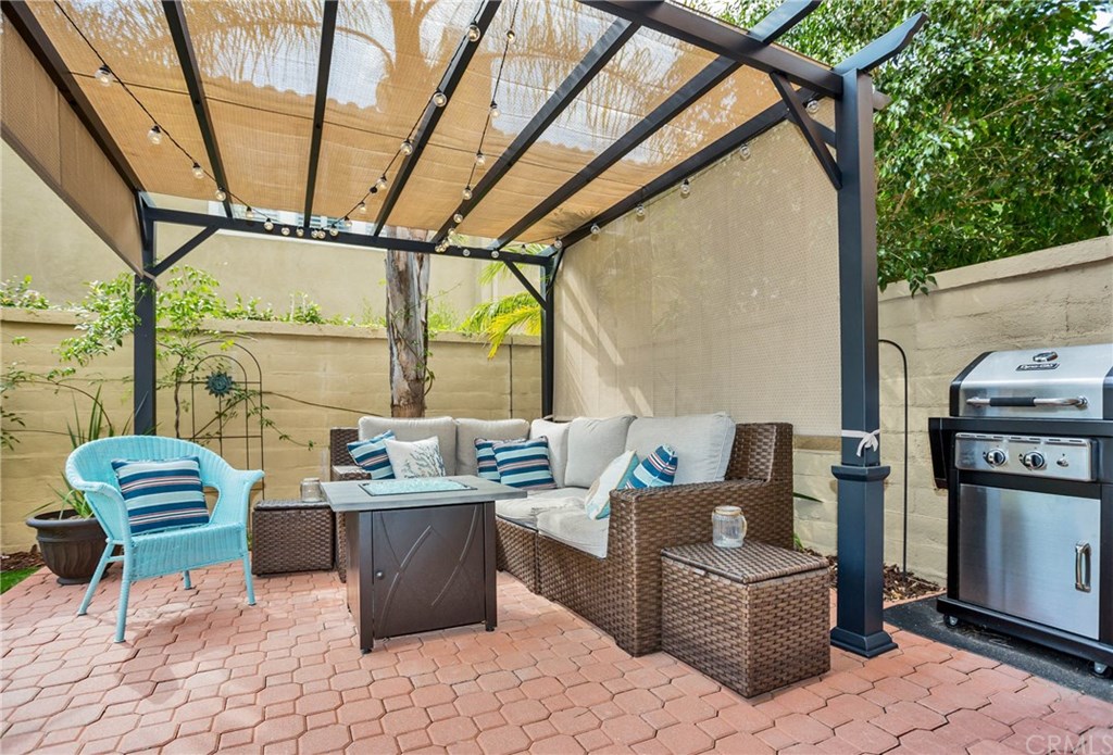 21 Corte Javier San Clemente, CA 92673 - Photo 12 of 30 The patio has been beautifully finished with pavers and features a lighted pergola for visiting outdoors in the evenings and offering shade on sunny days.