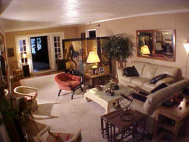 64 South Mendenhall Road Memphis, TN 38117 - Photo 4 of 10 The living room is very large. This owner has divided it somewhat with the screen. The door at the back goes into a large room that currently has a pool table and looks over the pool.