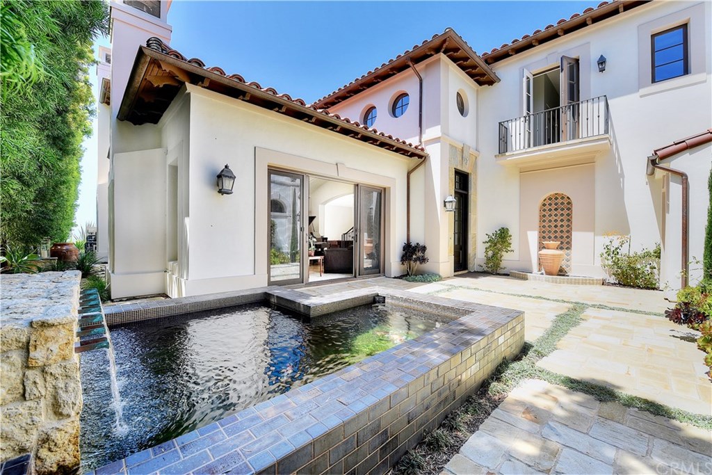 Beautiful private courtyard with koi pond prior to entering the front door.
