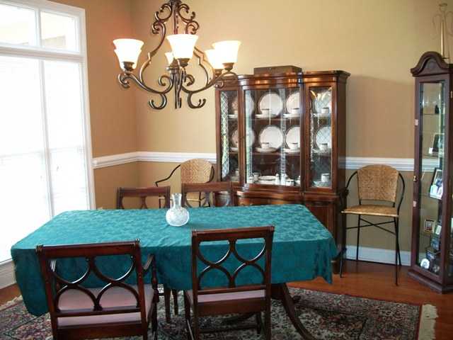 1270 Cherry Road Eads, TN 38028 - Photo 9 of 12 Great Formal Dining room - wood floors, chair rail and chic fixture