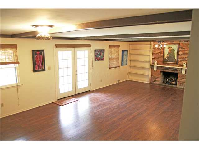 7685 Stout Road Germantown, TN 38138 - Photo 15 of 21 The walk out basement has yet another fireplace as well as another bedroom and bath ~ what a perfect game room this made when Olen & Numa Batchelor had it built and entertained here in the 1970's.