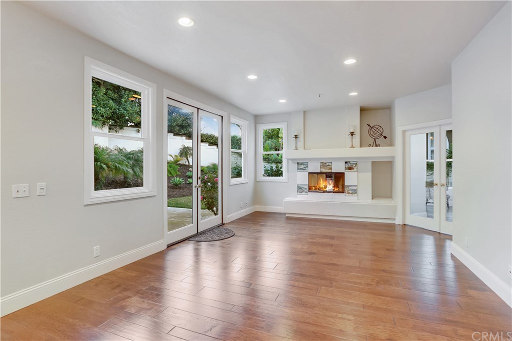 6 Via Colorso San Clemente, CA 92672 - Photo 7 of 32 Bright white clean living room with gorgeous fireplace and lots of windows.