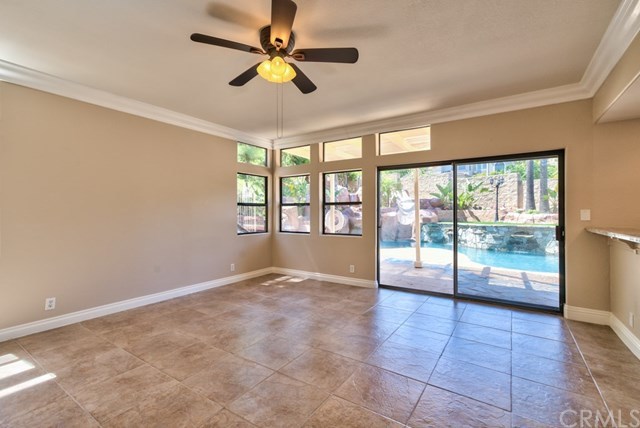 3086 Diamondview Circle Corona, CA 92882 - Photo 12 of 66 This is another angle of the family room overlooking the backyard and the swimming pool and spa.
