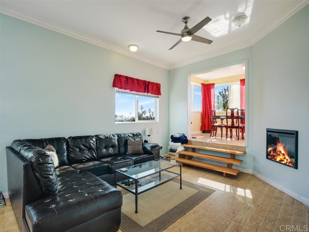 869 Beryl Street San Diego, CA 92109 - Photo 24 of 25 Living room of upstairs, 1 bedroom + loft. Tremendous light from numerous skylights, and ocean views from multiple windows. Open floor plan with high ceilings and new fireplace.