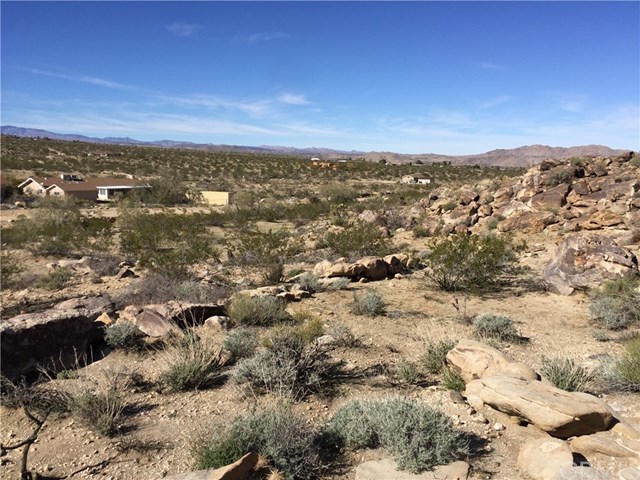 8140 Skyline Drive Joshua Tree, CA 92252 - Photo 18 of 27 The view from the interior where a new custom home may be sited.