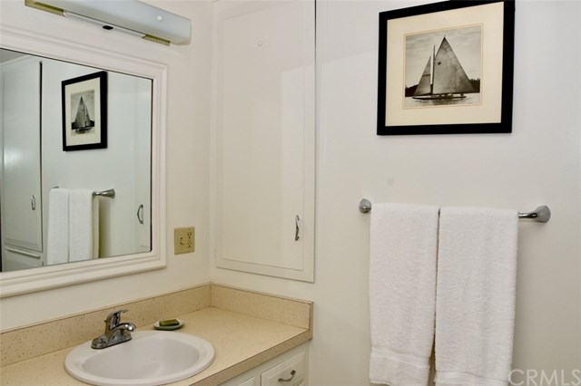 13881 Thunderbird Drive, Unit 64K Seal Beach, CA 90740 - Photo 20 of 21 Large cabinet next to sink for ease and convenience.