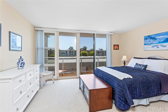4002 Aladdin Drive Huntington Beach, CA 92649 - Photo 6 of 55 The Master bedroom has a peak ocean view from the balcony!