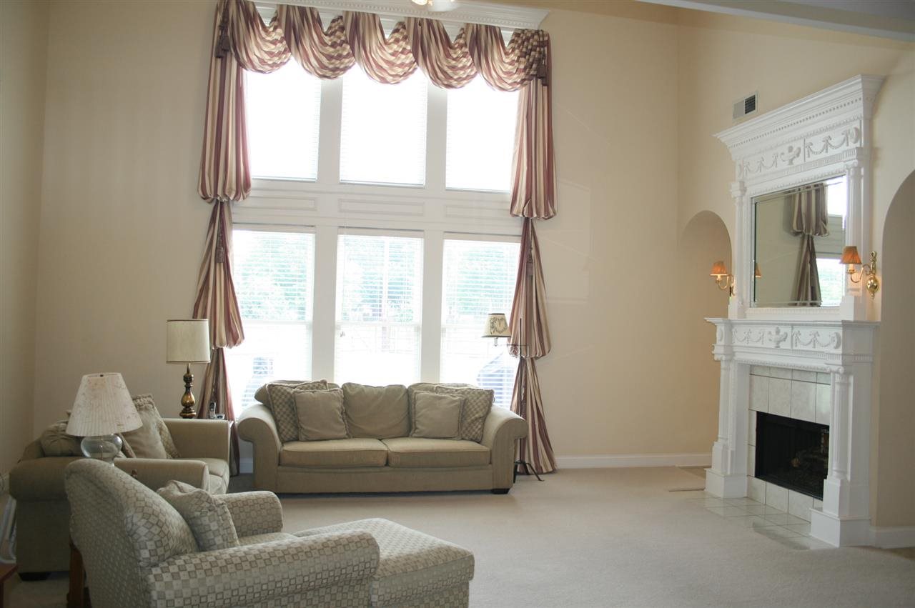 855 Hatton Street Collierville, TN 38017 - Photo 9 of 25 The TALL windows and double mantle fireplace are dramatic and add to the visual interest of this room!