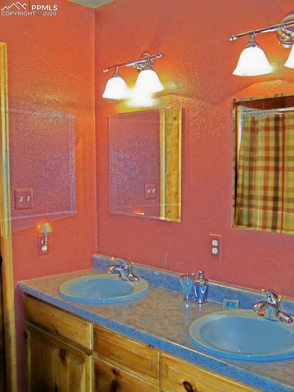 2602 Southpark Road Florissant, CO 80816 - Photo 12 of 25 Master Bath with Oversized Shower, Linen Closet & Double Vanities