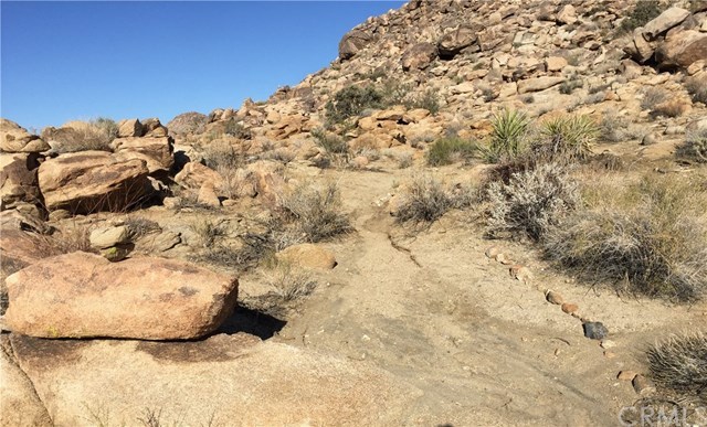 8140 Skyline Drive Joshua Tree, CA 92252 - Photo 10 of 27 Own your own piece of the legendary Joshua Tree landscape with this extraordinary five acres near the Joshua Tree National Park. Build your desert dream home nestled among the boulders.
