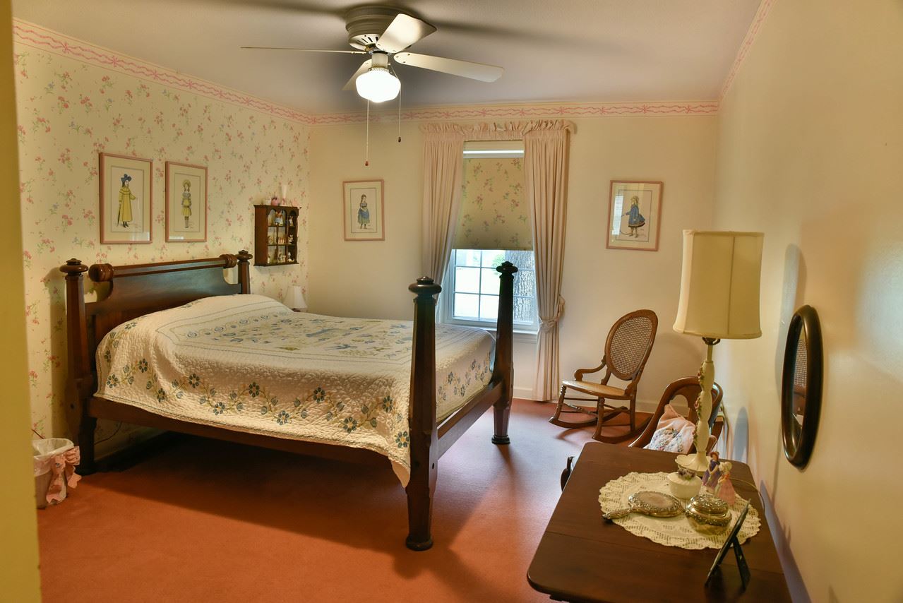 5291 Shady Grove Road Memphis, TN 38120 - Photo 13 of 23 Bedroom 2 is spacious and has hardwood under carpet.