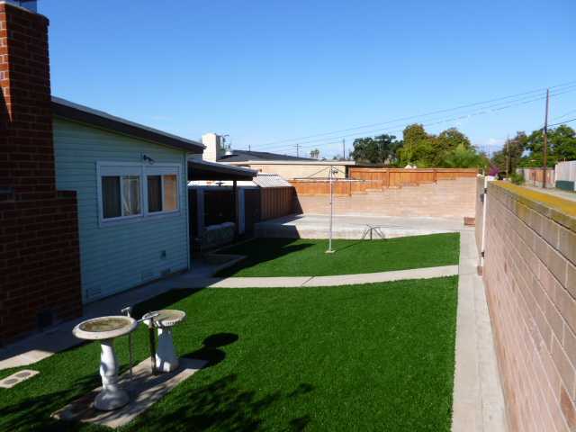 2851 Murray Ridge Road San Diego, CA 92123 - Photo 10 of 12 Alley access to E-Z care backyard with a covered patio, storage sheds & a concrete slab for 1 car parking!
