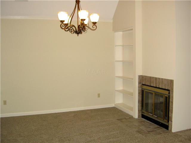 7103 Belsfield Road Memphis, TN 38119 - Photo 6 of 25 Built-in bookcases flank the double fireplace in the Dining Room as well. New chandelier and new carpet.