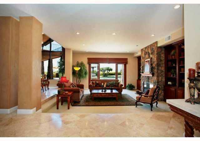 3420 Adams Run Encinitas, CA 92024 - Photo 6 of 25 View as you enter the home. Large slider doors lead out to beautiful backyard. Custom stone fireplace and built-in shelves in living room.