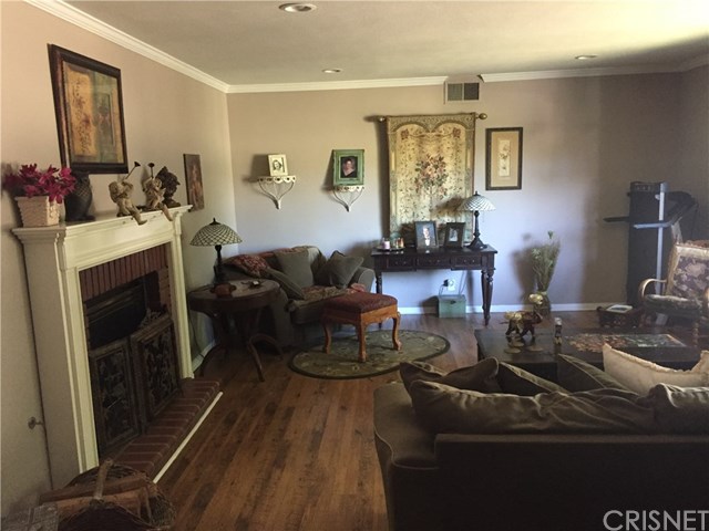 19116 Olympia Street Porter Ranch, CA 91326 - Photo 36 of 41 FIREPLACE IN LIVING ROOM