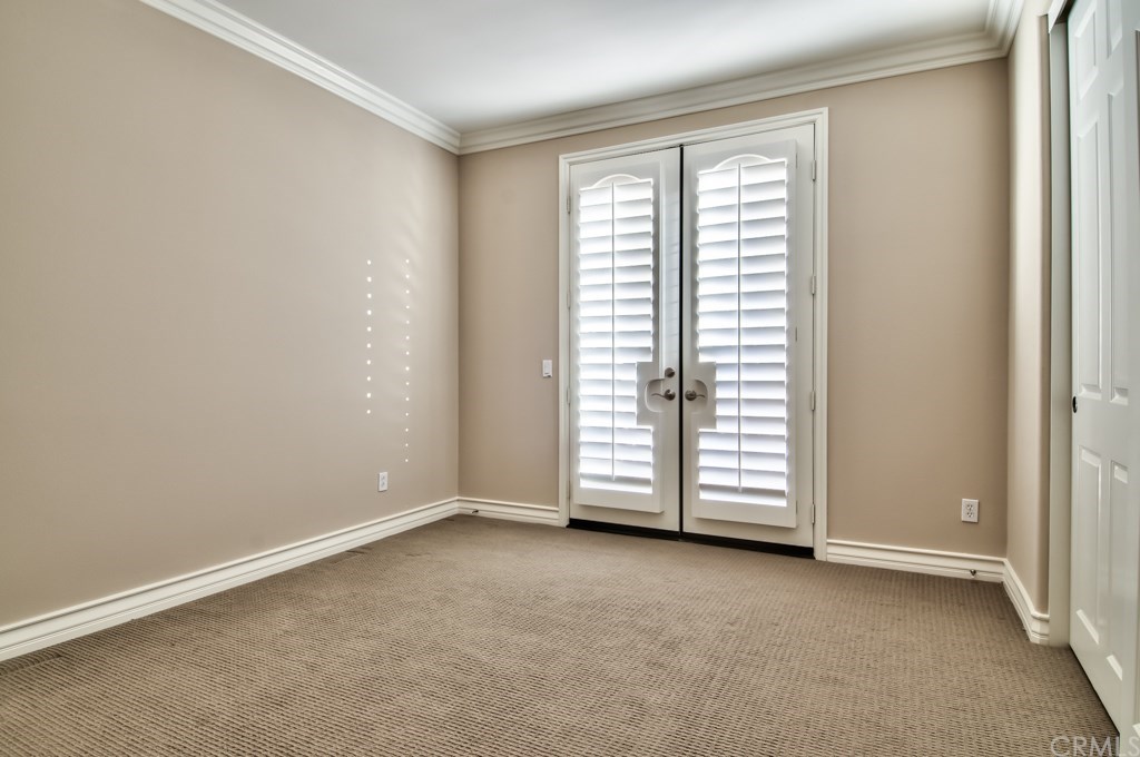 2148 Sageleaf Circle Corona, CA 92882 - Photo 54 of 74 This bedroom has access to the deck/lanai on the south side of the house.