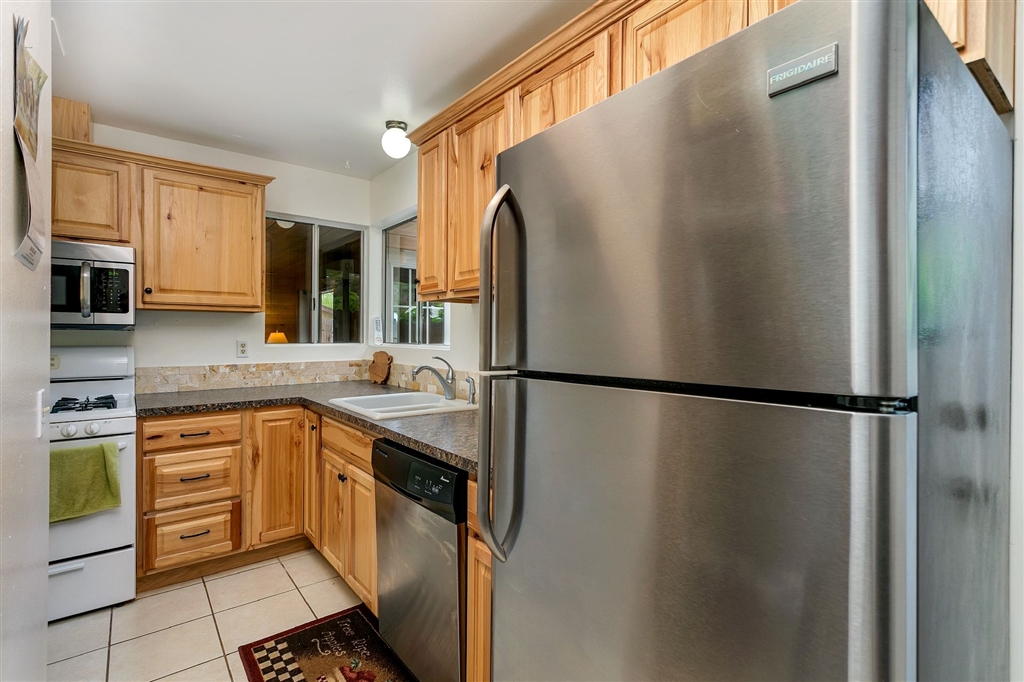 1387 Peacock Boulevard Oceanside, CA 92056 - Photo 7 of 15 The refrigerator is among the newer major appliances in the house, including a new furnace and water heater.
