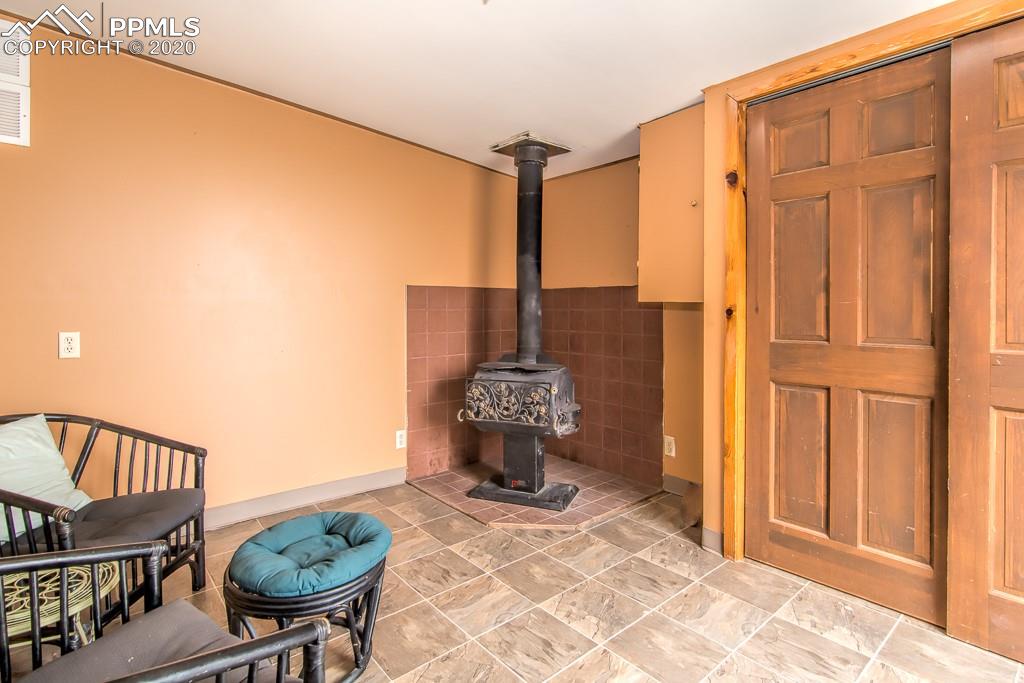 37655 Truckton Road Yoder, CO 80864 - Photo 33 of 35 Family Room in Second Home with Wood Burning Stove
