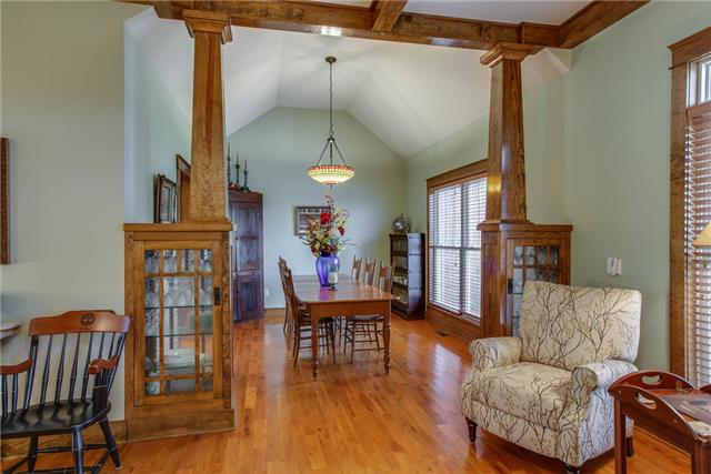 13920 Patterson Road College Grove, TN 37046 - Photo 11 of 30 Ahead is the dining room fit for large parties. Notice the glass curios built in to the columns flanking the dining room.