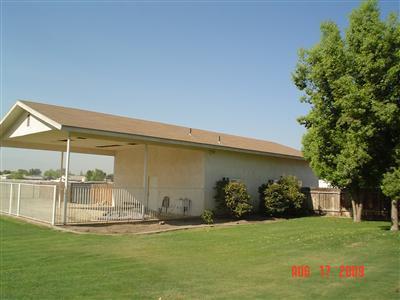 6937 Lindsay Road Bakersfield, CA 93313 - Photo 10 of 15 28'x40' stucco shop with 3 roll up doors and 3/4 bath