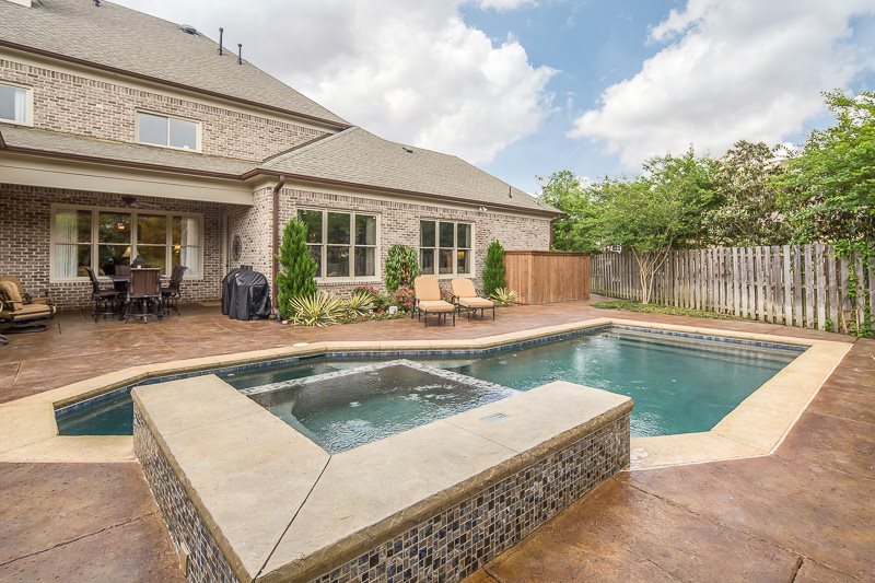 10139 Avent Ridge Collierville, TN 38017 - Photo 23 of 25 With the covered patio, fireplace area, and pool/spa, there is a spot for everyone to enjoy!