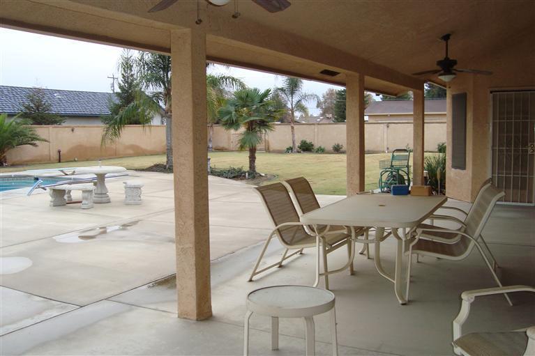 3248 Jenkins Road Bakersfield, CA 93314 - Photo 3 of 20 Generous covered patio and expansive deck. Privacy in back yard with perimeter wall that cross fences the back yard from the shop area.