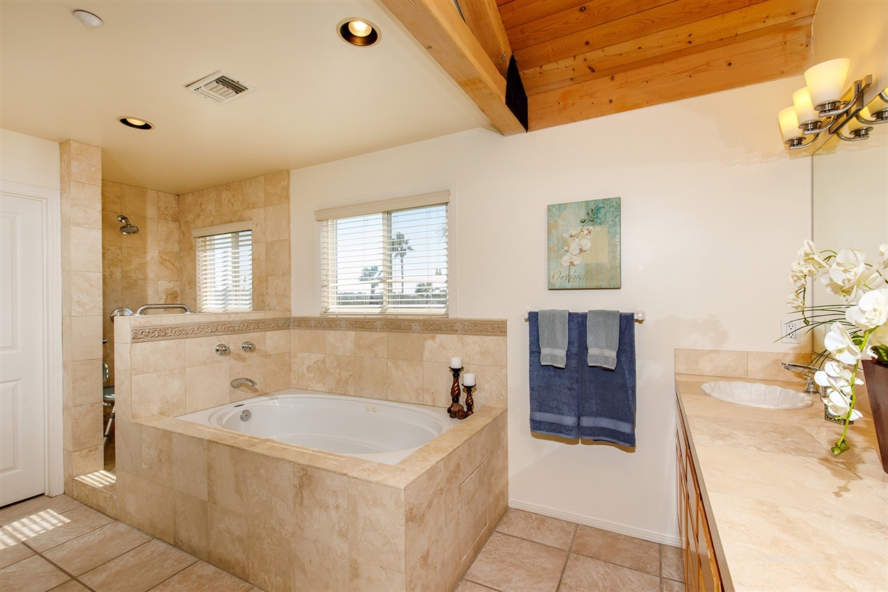 449 Ocean View Avenue Encinitas, CA 92024 - Photo 16 of 23 Tiled shower and a large walk-in closet in master bathrooms