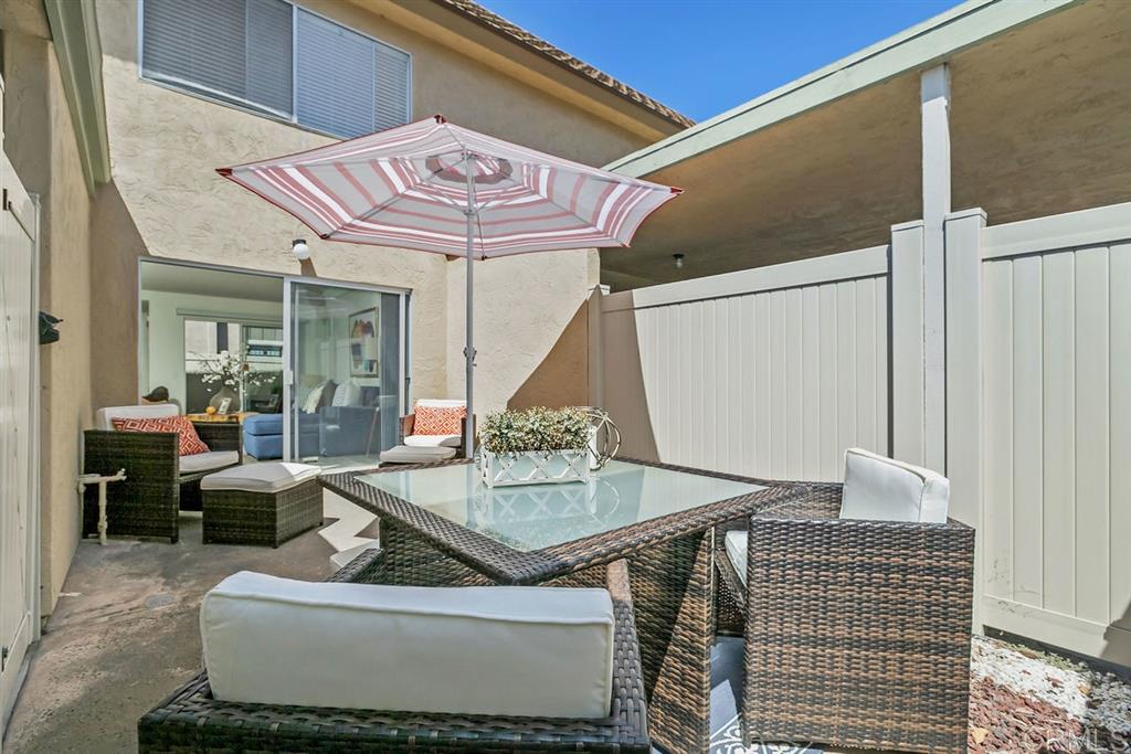 7855 Hummingbird Lane San Diego, CA 92123 - Photo 18 of 25 Enjoy San Diego's beautiful weather all year from one of two patio. The back patio is accessible from the living room and the carport area.