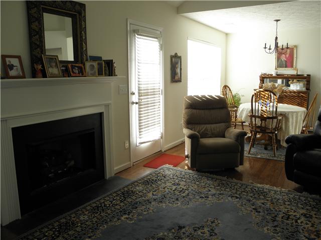 1305 West Running Brook Road Nashville, TN 37209 - Photo 7 of 30 Greatroom w/fireplace, vaulted ceiling, ceiling fan, open to the formal dining room, plant shelf.