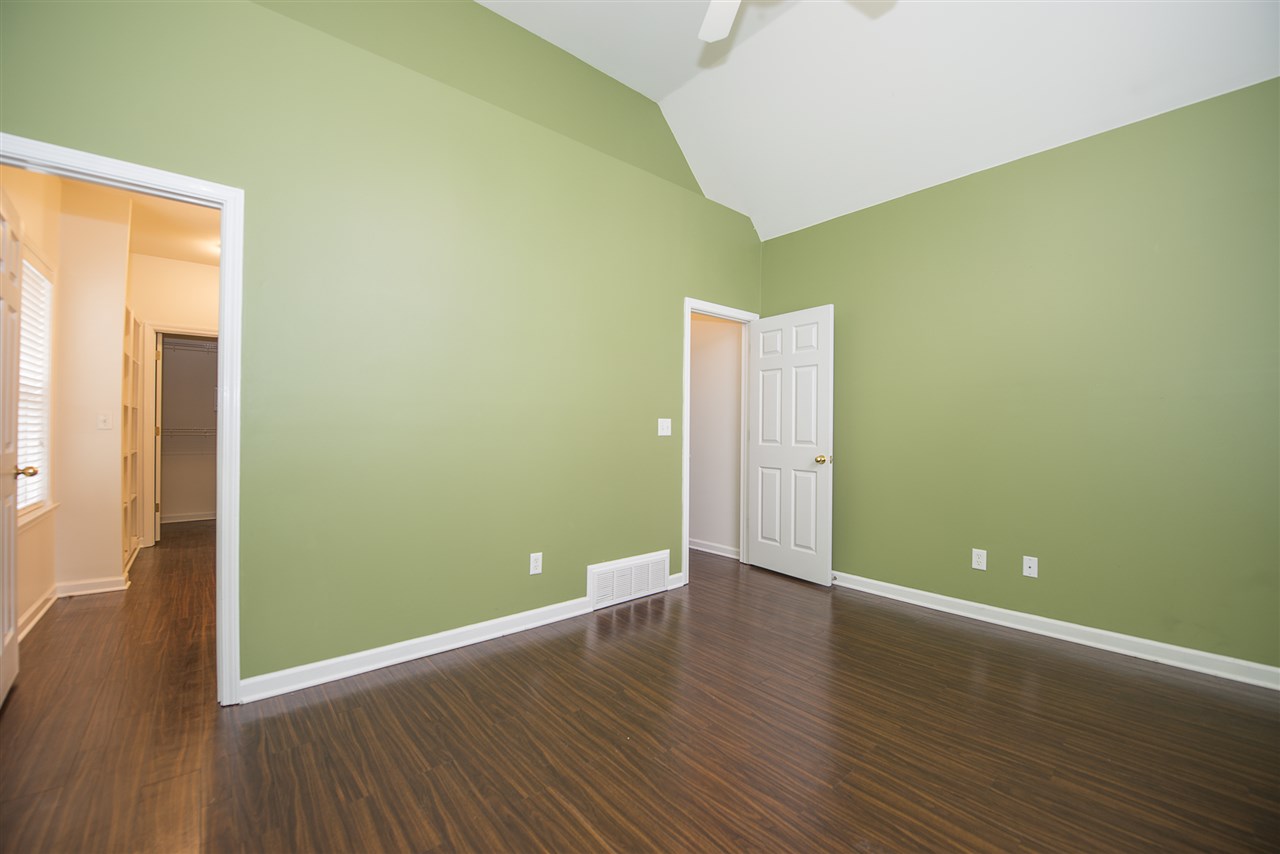 1237 Misty Isle Drive Memphis, TN 38103 - Photo 9 of 22 Features an on suite master bath and a large plant shelf over the interior wall to accentuate the ceiling height.