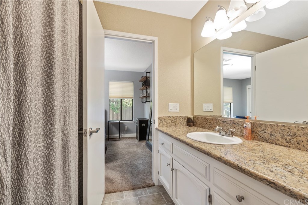 628 4th Street Paso Robles, CA 93446 - Photo 14 of 22 Jack and Jill style upstairs full bath with granite counter vanity