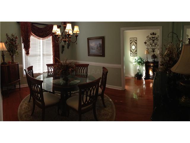439 Brook Ridge Circle Cordova, TN 38018 - Photo 7 of 16 Hardwood floor in freshly painted Dining Room with attractive light fixture.