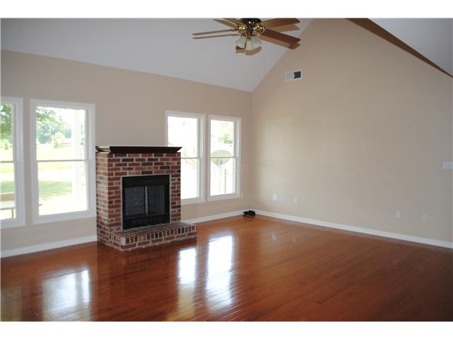 668 Ballard Road Piperton, TN 38017 - Photo 3 of 12 Very large and lovely great room open to the kitchen. Nice wood floors and amazing view of back acreage.