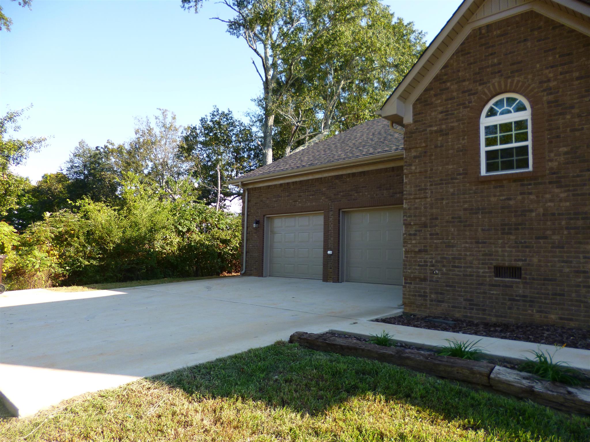 236 Old Camargo Road Fayetteville, TN 37334 - Photo 6 of 21 Garage has concrete pad and sidewalk to front porch
