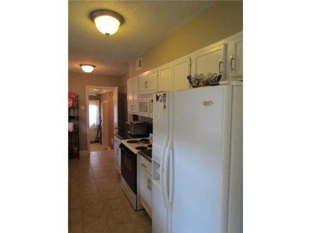 5334 Chickasaw Road Memphis, TN 38120 - Photo 12 of 25 There is also a new electric stove, a built-in microwave, and the fridge stays!