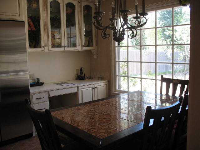 7586 Apple Valley Road Germantown, TN 38138 - Photo 4 of 12 Breakfast area of kitchen with built-in desk and cabinetry